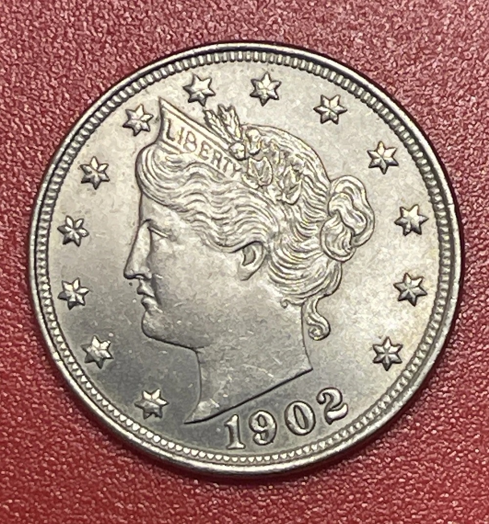 1902 Liberty nickel grading strip showing Good, Fine, About Uncirculated, and Mint State condition examples side by side
